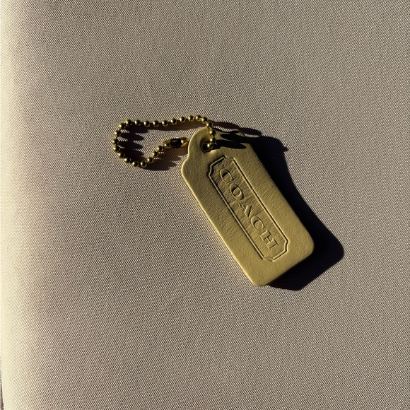 Coach Handbags - Vintage Coach Leather Hangtag Fob Yellow